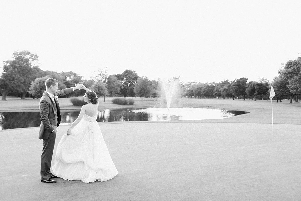 Arielle Peters Photography | Bride and groom on golf course next to pond on wedding day at Morris Park Country Club in South Bend, Indiana.