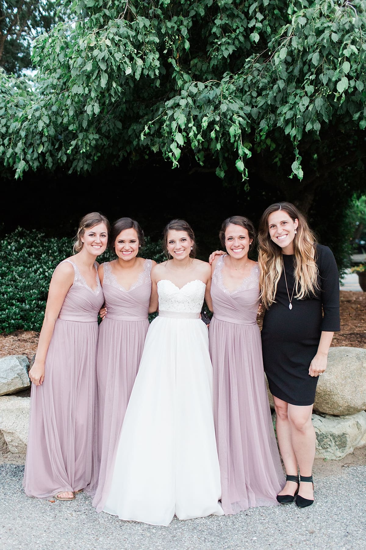 Arielle Peters Photography | Bride and bridesmaids next to tree on wedding day at Morris Park Country Club in South Bend, Indiana.