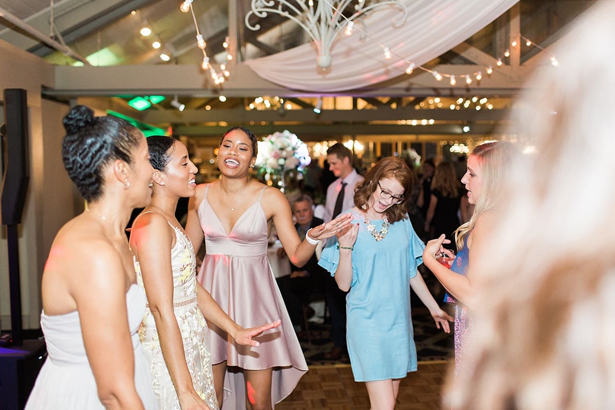 Arielle Peters Photography | Wedding guests dancing at wedding reception on wedding day at Morris Park Country Club in South Bend, Indiana.