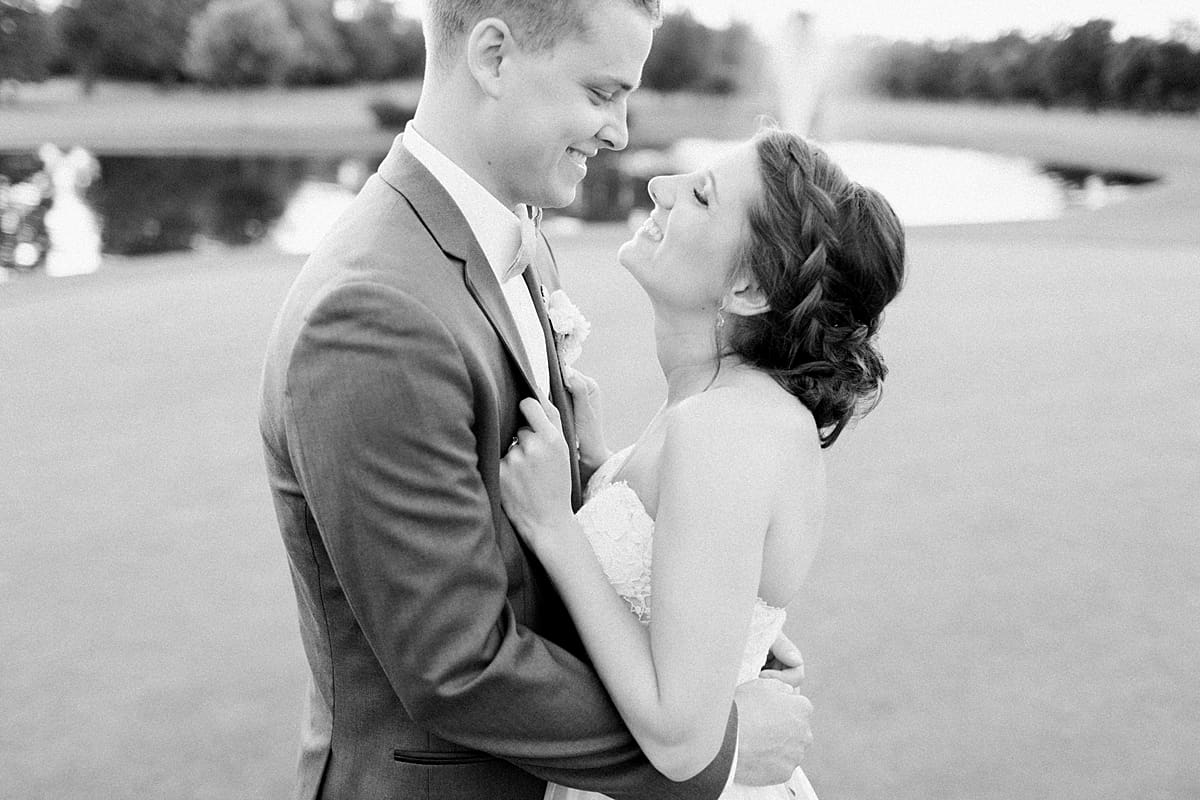Arielle Peters Photography | Bride and groom on golf course next to pond on wedding day at Morris Park Country Club in South Bend, Indiana.