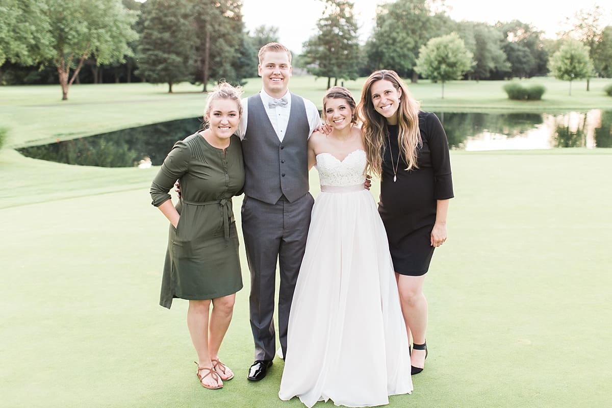Arielle Peters Photography | Bride and groom on golf course next to pond on wedding day at Morris Park Country Club in South Bend, Indiana.