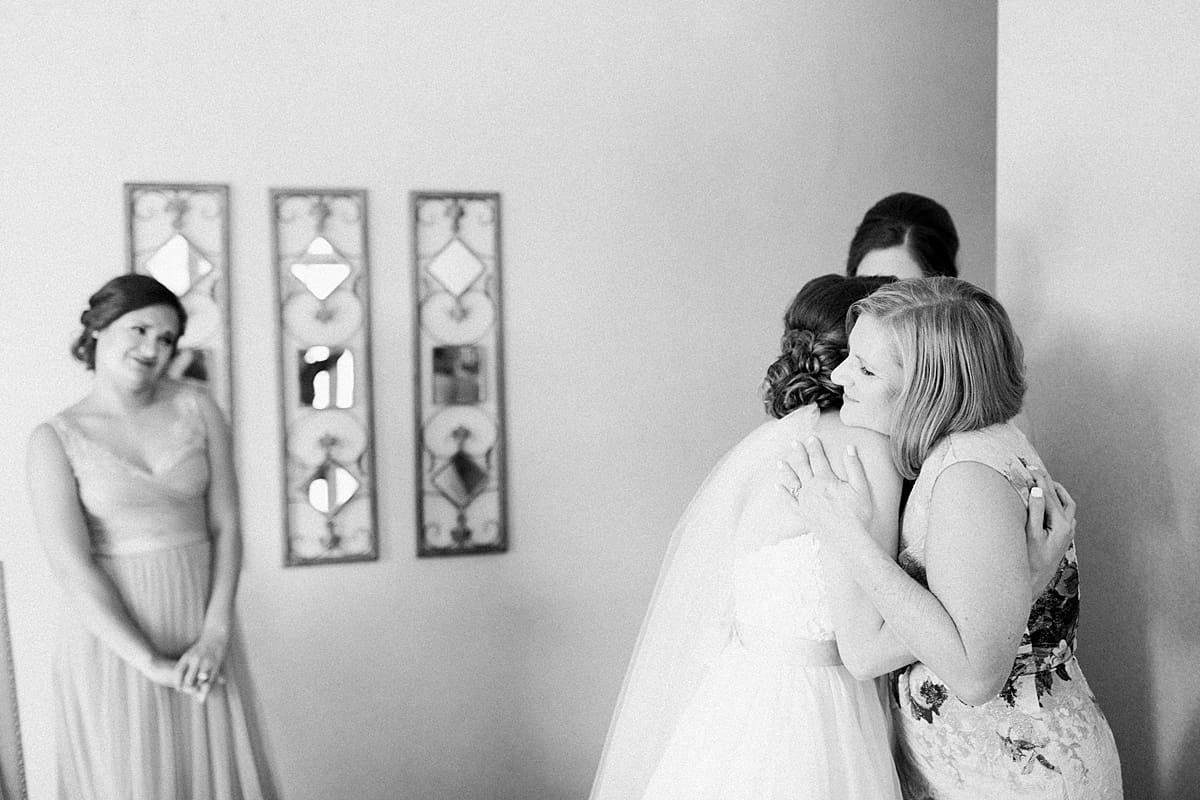 Arielle Peters Photography | Mother of bride and bride hugging on wedding day at Morris Park Country Club in South Bend, Indiana.