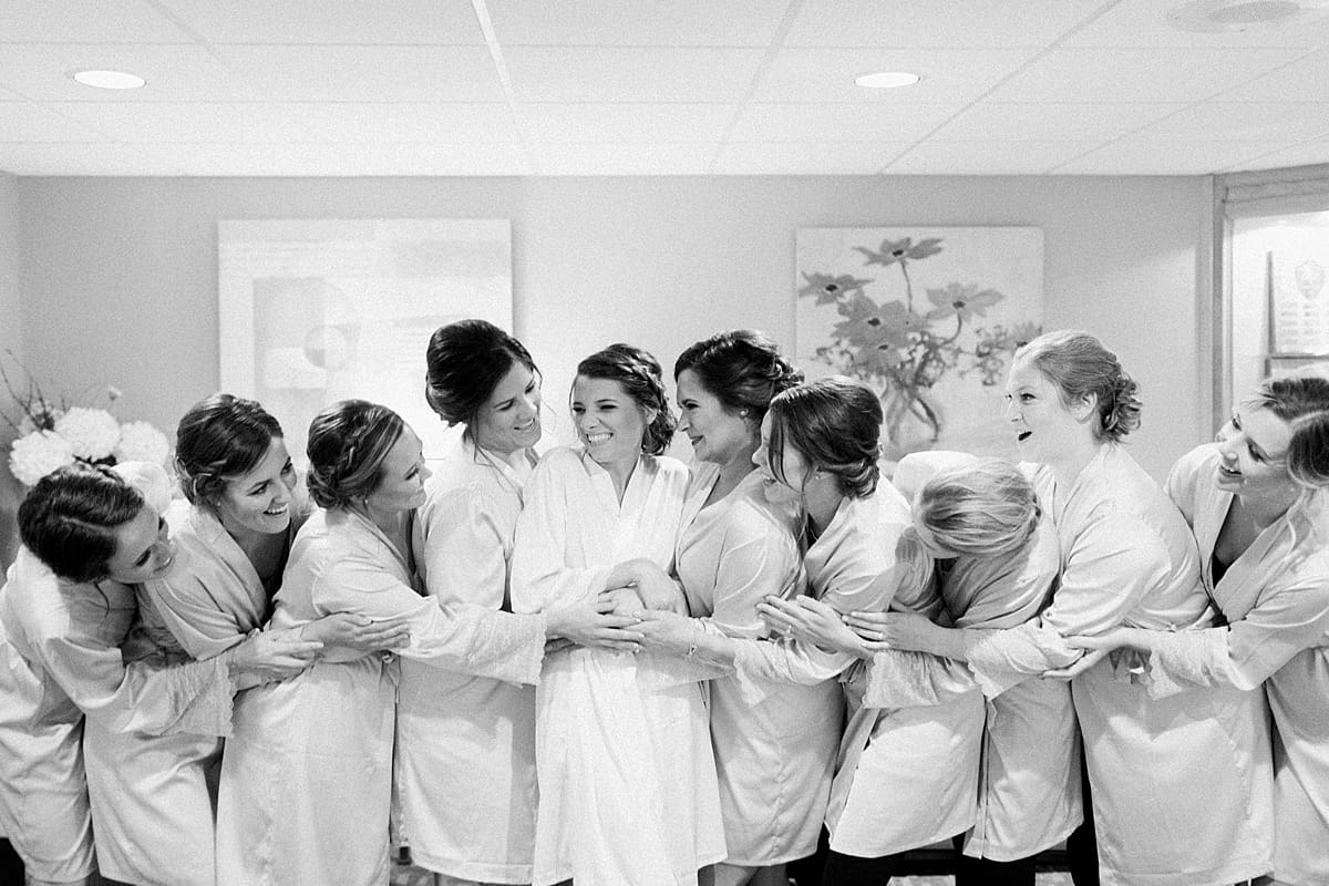 Arielle Peters Photography | Bride and bridesmaids in robes getting ready on wedding day at Morris Park Country Club in South Bend, Indiana.