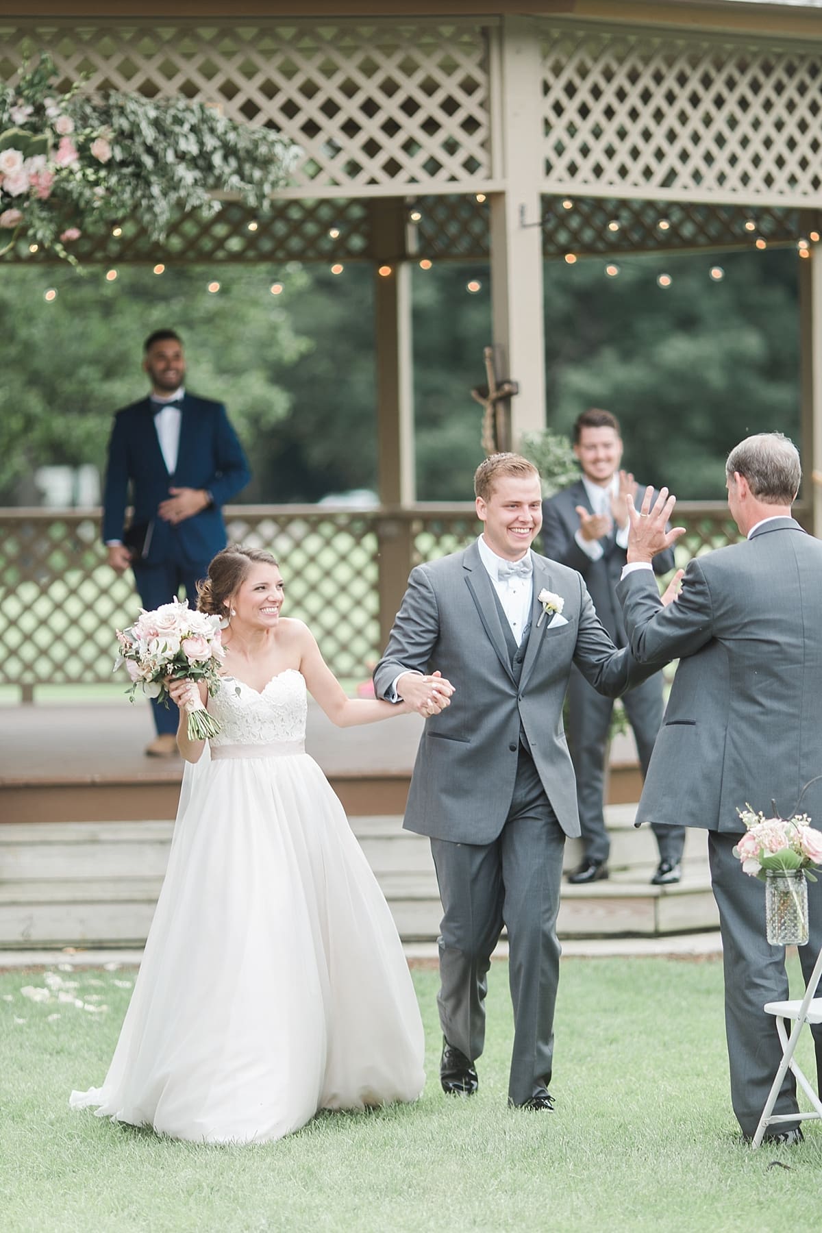 Arielle Peters Photography | Bride and groom walking down the aisle on wedding day at Morris Park Country Club in South Bend, Indiana.