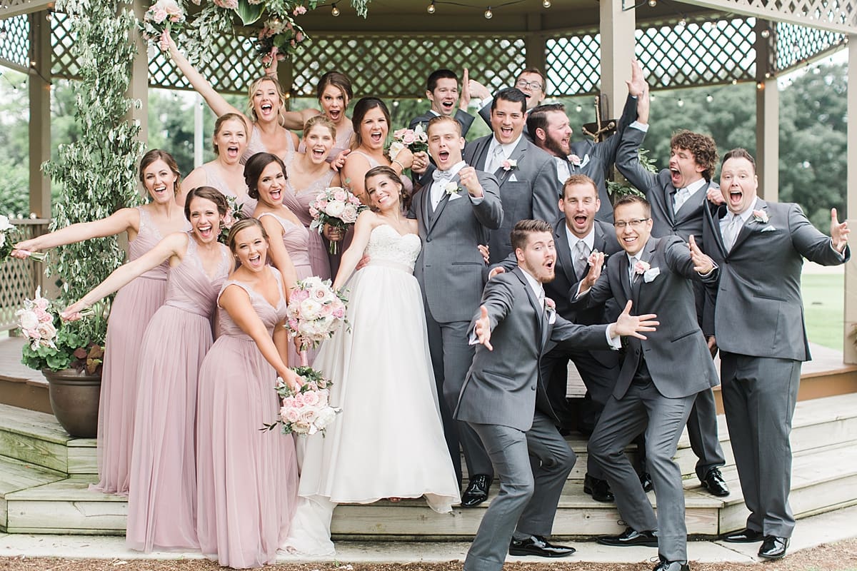 Arielle Peters Photography | Wedding party cheering under gazebo on wedding day at Morris Park Country Club in South Bend, Indiana.