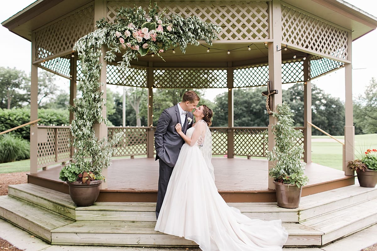 Arielle Peters Photography | Bride and groom almost kissing under gazebo on wedding day at Morris Park Country Club in South Bend, Indiana.
