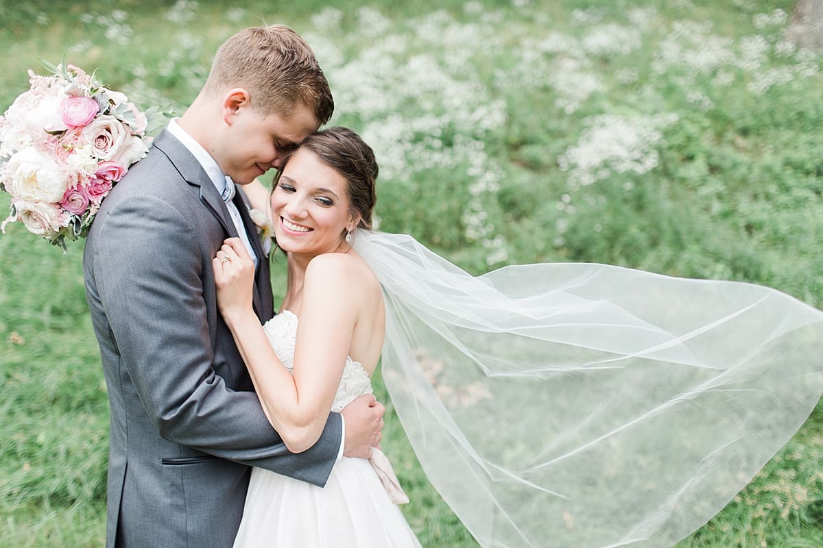 Arielle Peters Photography | Bride and groom hugging on golf course on wedding day at Morris Park Country Club in South Bend, Indiana.
