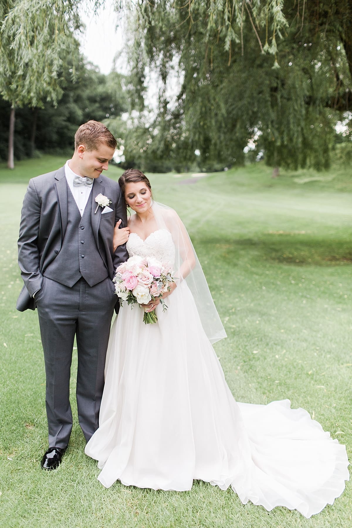 Arielle Peters Photography | Bride and groom walking on golf course on wedding day at Morris Park Country Club in South Bend, Indiana.