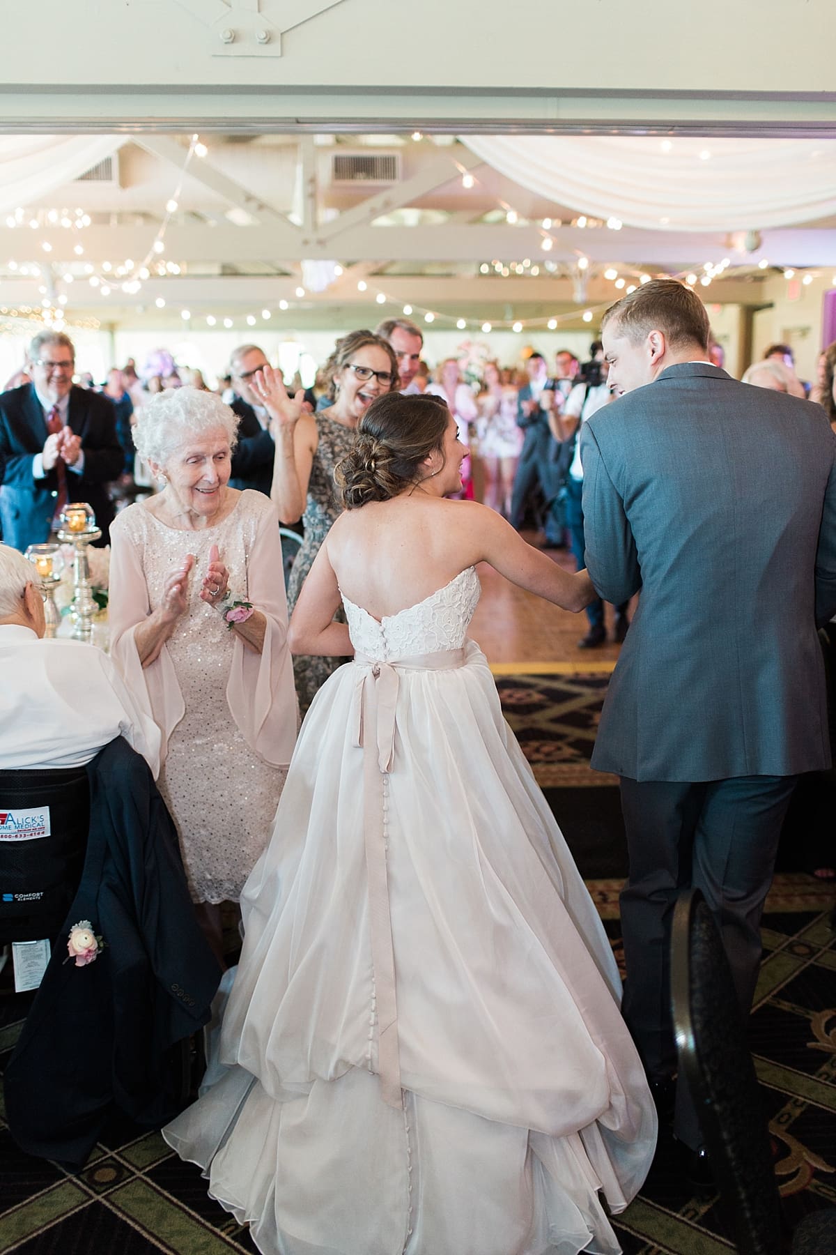 Arielle Peters Photography | Bride and groom entering wedding reception on wedding day at Morris Park Country Club in South Bend, Indiana.