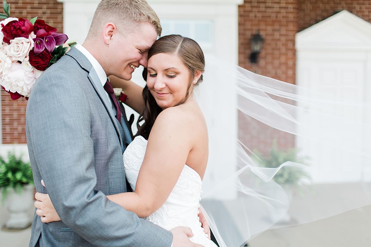 Arielle Peters Photography | Bride and groom outside brick church on wedding day at Trinity Church in South Bend, Indiana.