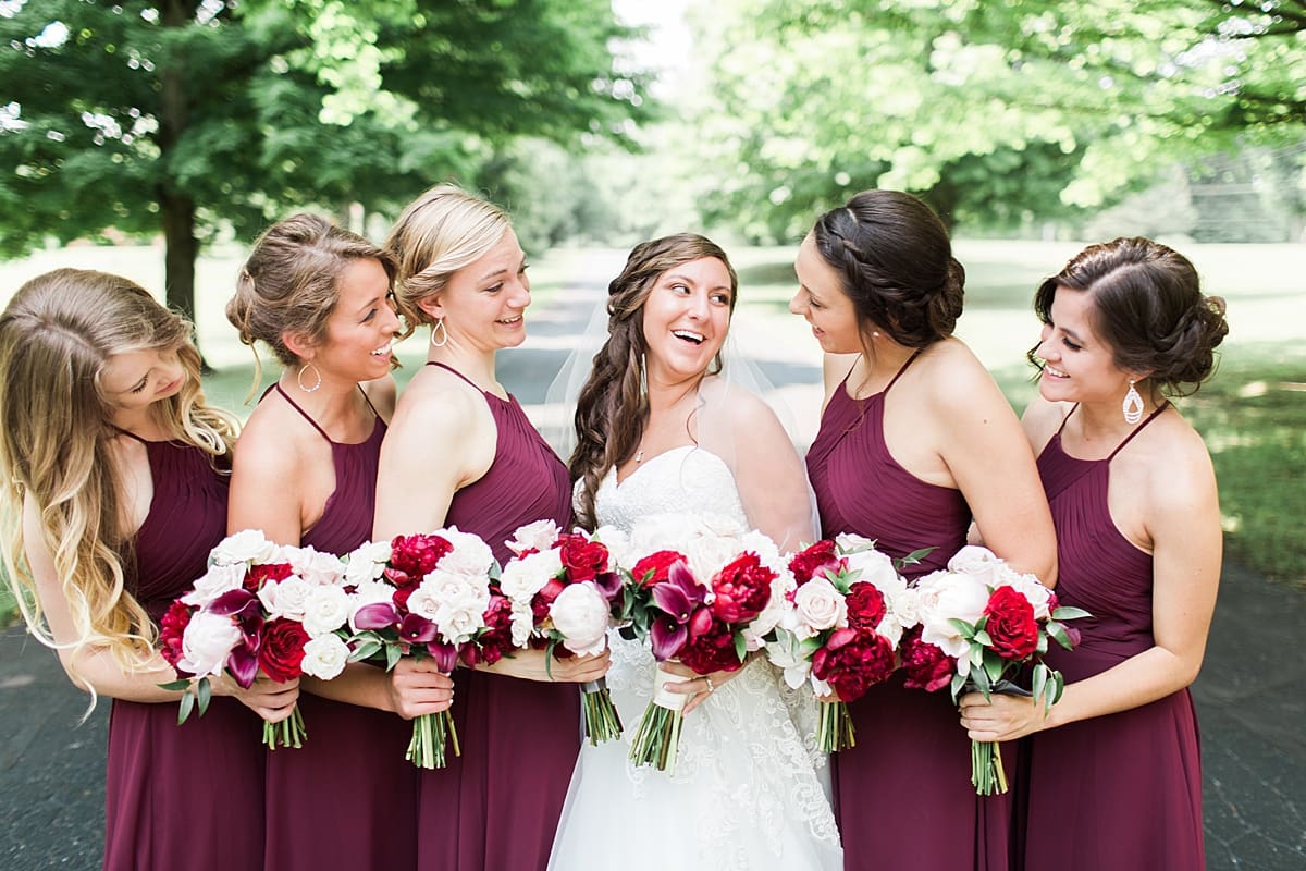 Arielle Peters Photography | Bride and bridesmaids on empty street on wedding day at Trinity Church in South Bend, Indiana.