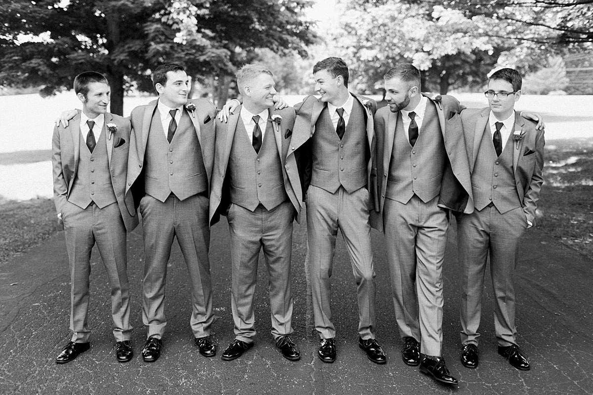 Arielle Peters Photography | Groom and groomsmen on empty street on wedding day at Trinity Church in South Bend, Indiana.