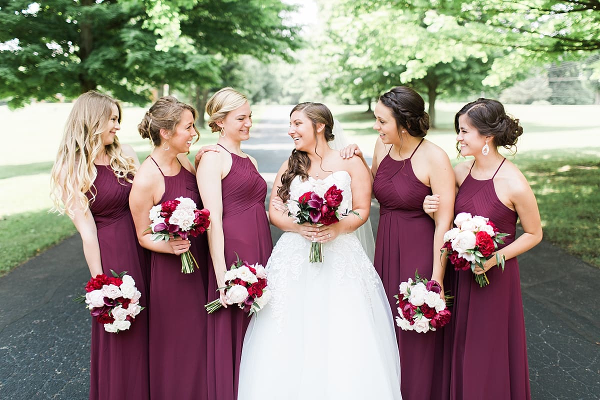Arielle Peters Photography | Bride and bridesmaids on empty street on wedding day at Trinity Church in South Bend, Indiana.
