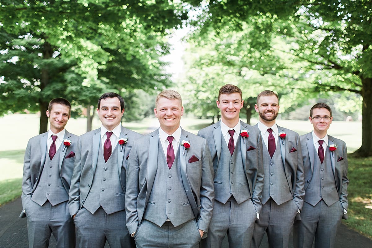 Arielle Peters Photography | Groom and groomsmen on empty street on wedding day at Trinity Church in South Bend, Indiana.