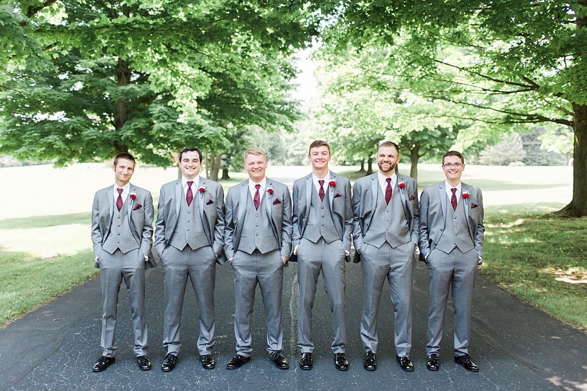 Arielle Peters Photography | Groom and groomsmen on empty street on wedding day at Trinity Church in South Bend, Indiana.