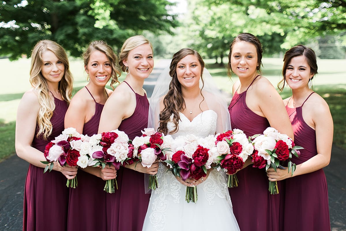 Arielle Peters Photography | Bride and bridesmaids on empty street on wedding day at Trinity Church in South Bend, Indiana.