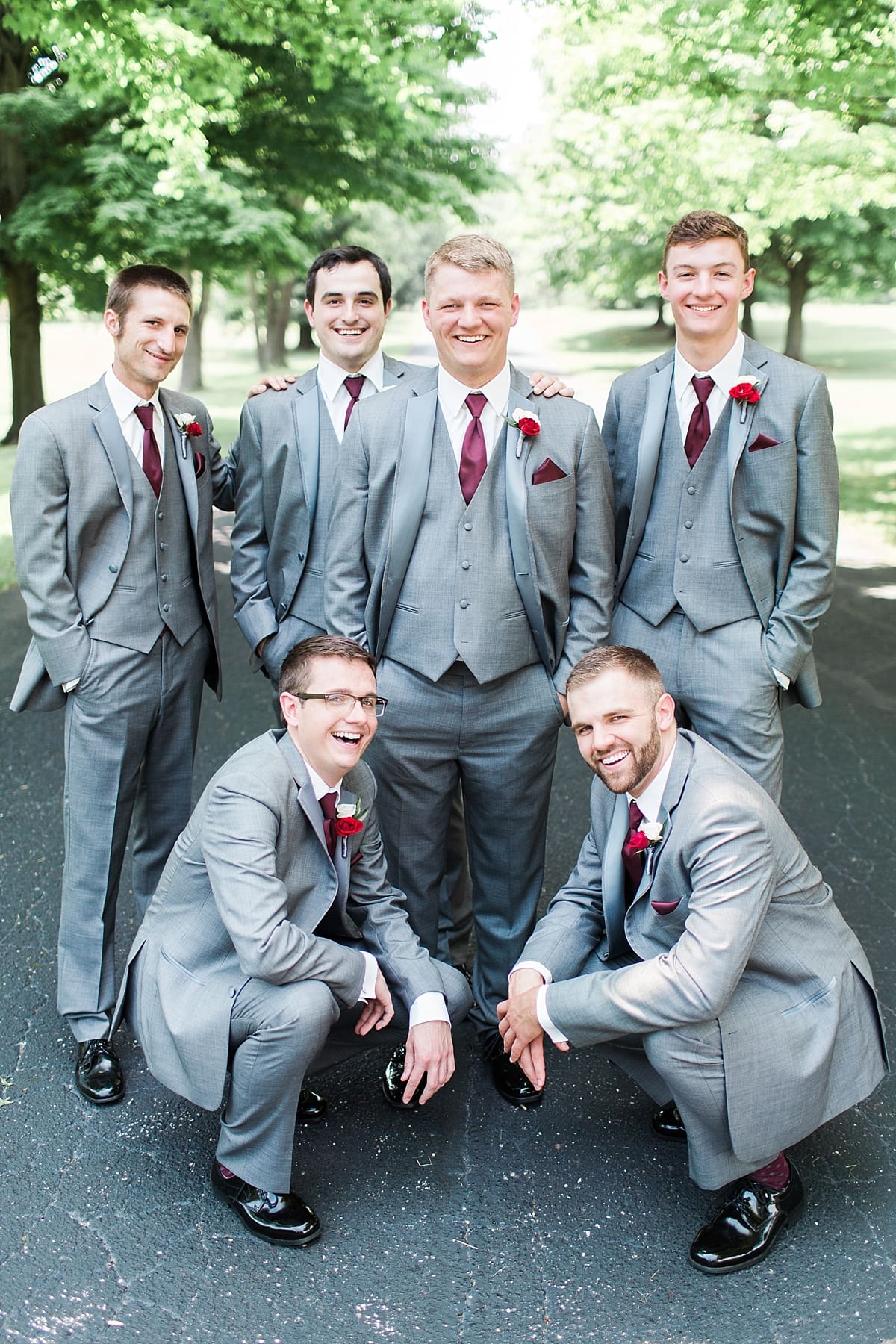 Arielle Peters Photography | Groom and groomsmen on empty street on wedding day at Trinity Church in South Bend, Indiana.