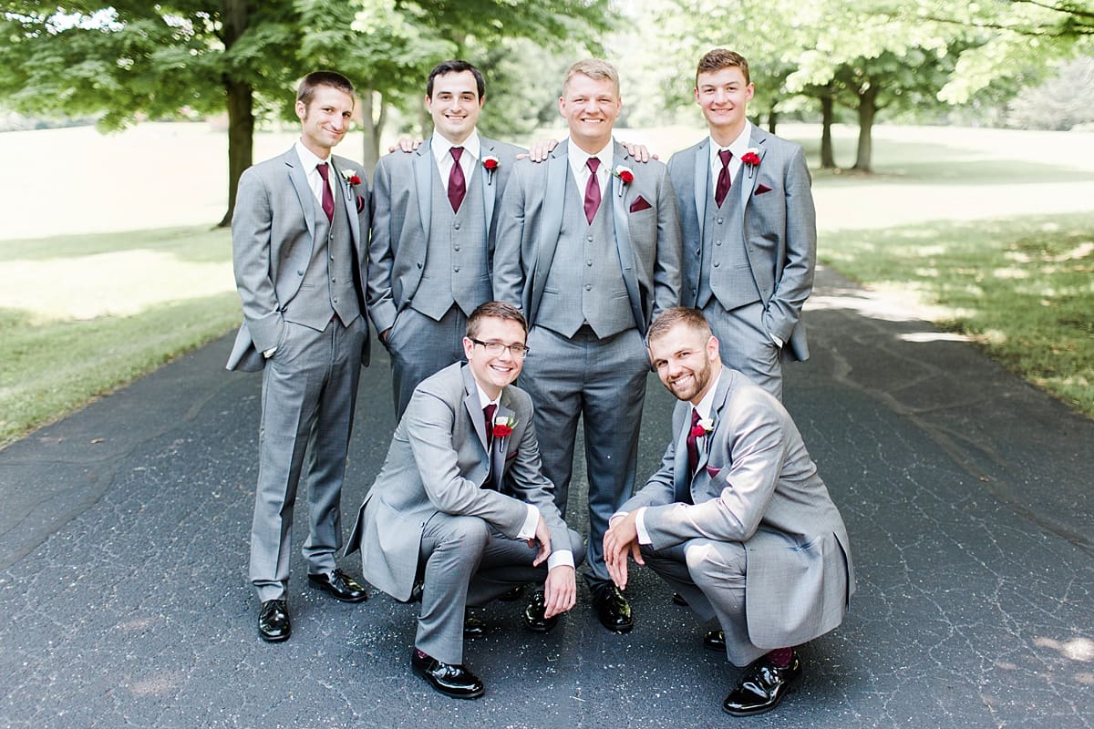 Arielle Peters Photography | Groom and groomsmen on empty street on wedding day at Trinity Church in South Bend, Indiana.