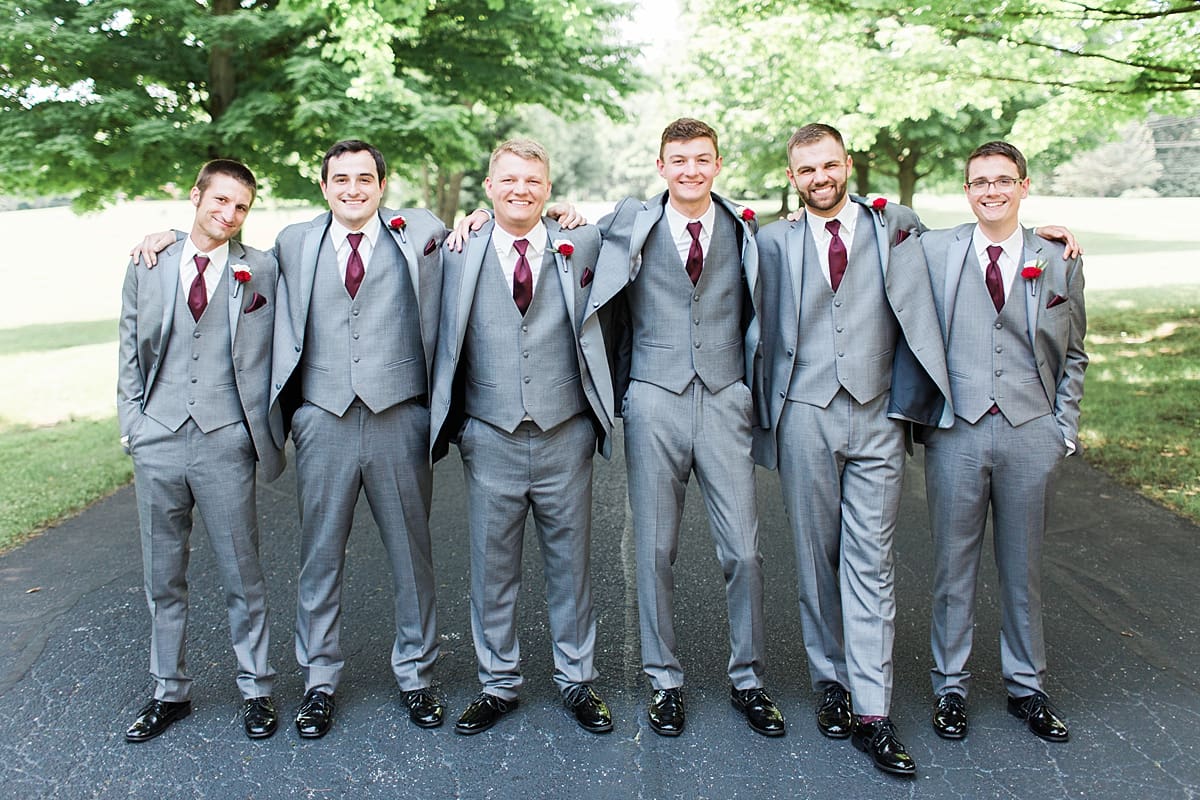 Arielle Peters Photography | Groom and groomsmen on empty street on wedding day at Trinity Church in South Bend, Indiana.