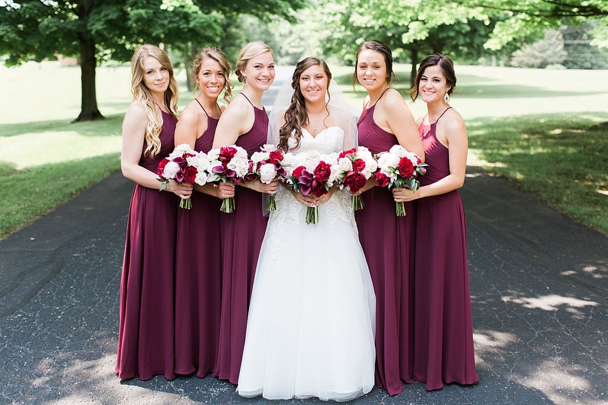 Arielle Peters Photography | Bride and bridesmaids on empty street on wedding day at Trinity Church in South Bend, Indiana.