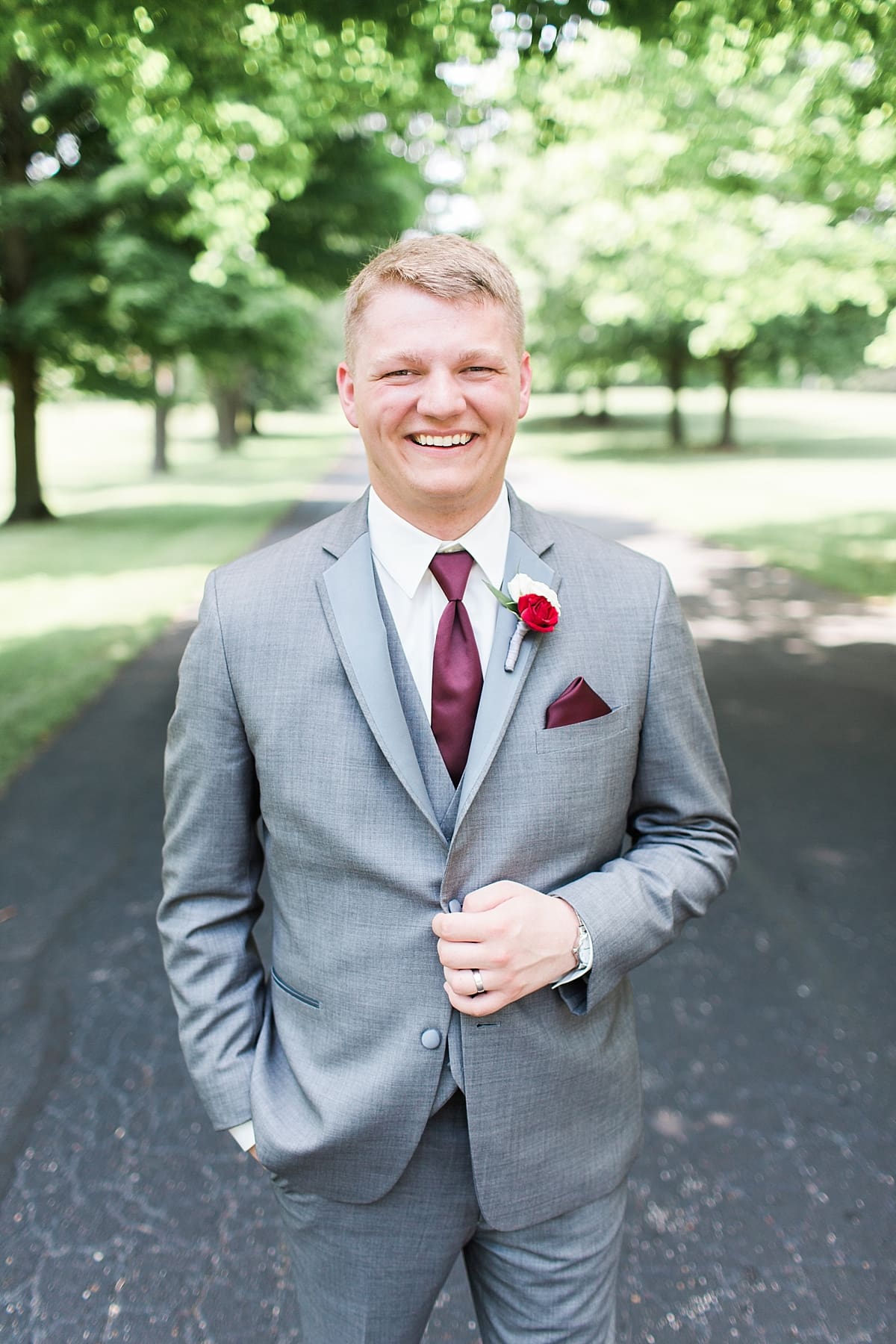 Arielle Peters Photography | Groom on empty street on wedding day at Trinity Church in South Bend, Indiana.