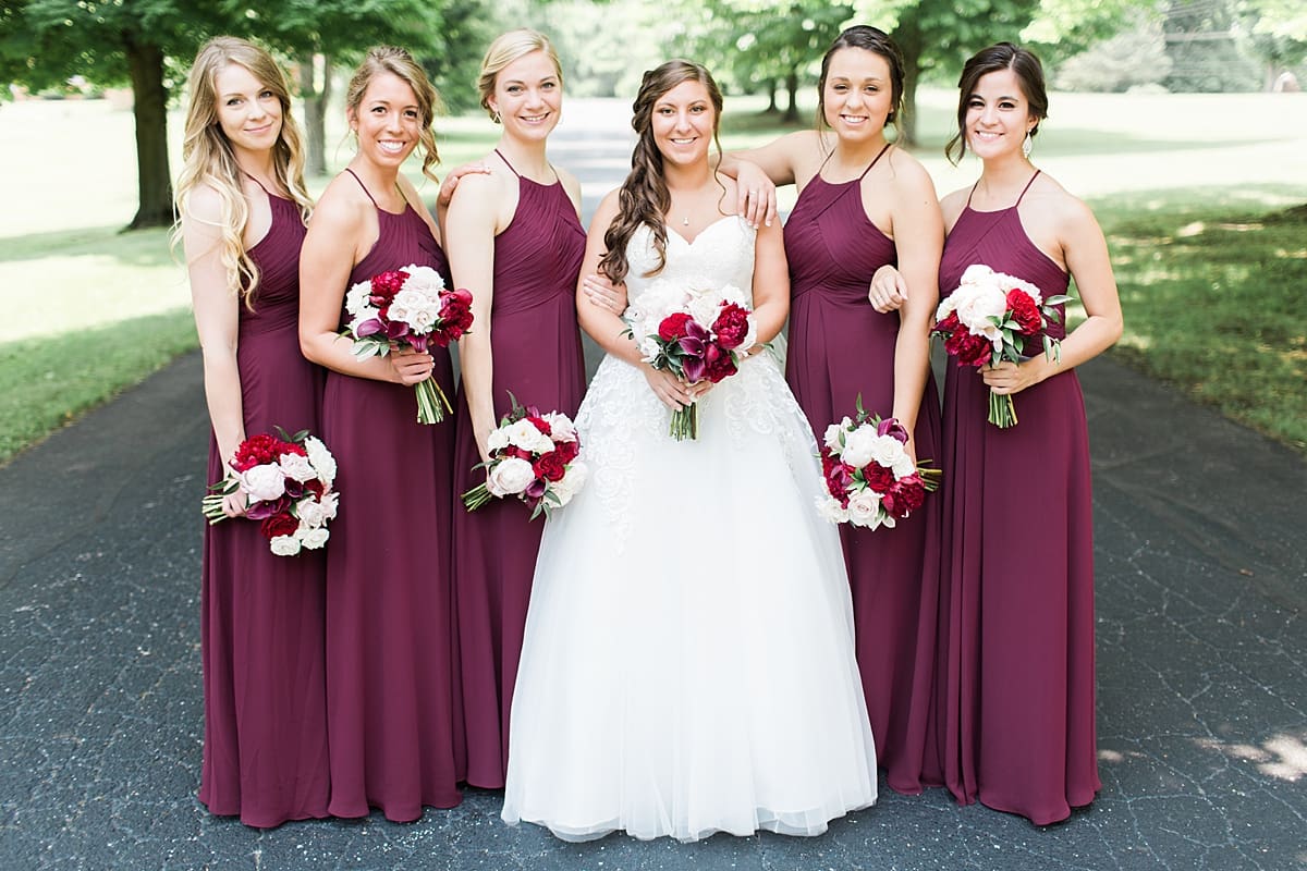 Arielle Peters Photography | Bride and bridesmaids on empty street on wedding day at Trinity Church in South Bend, Indiana.