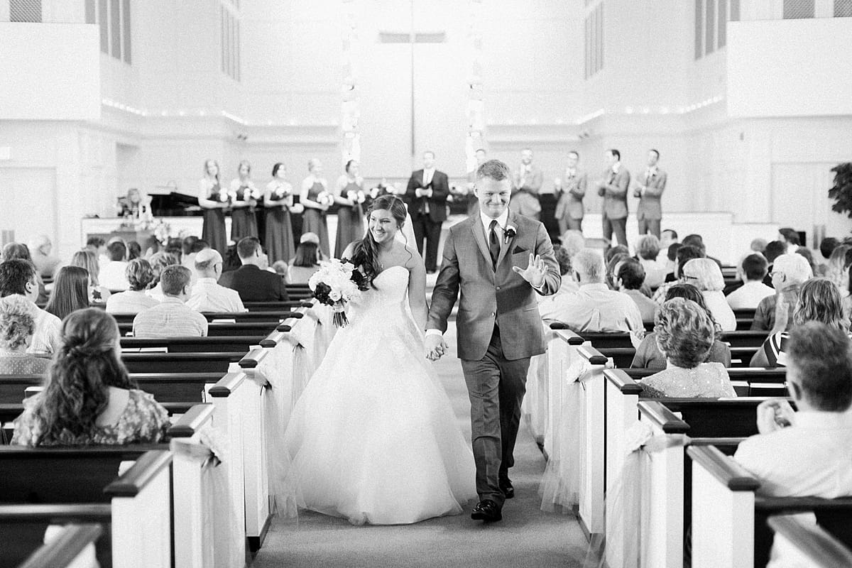 Arielle Peters Photography | Bride and groom walking down the aisle on wedding day at Trinity Church in South Bend, Indiana.
