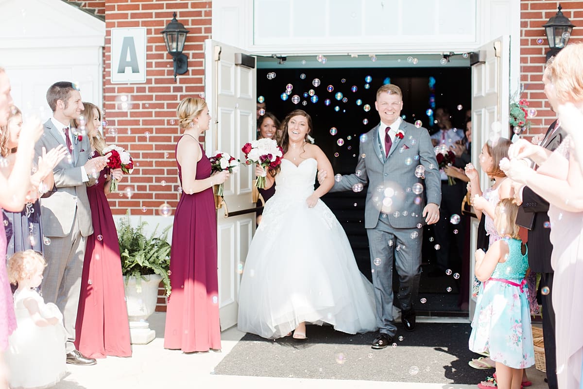 Arielle Peters Photography | Bride and groom exiting church on wedding day at Trinity Church in South Bend, Indiana.