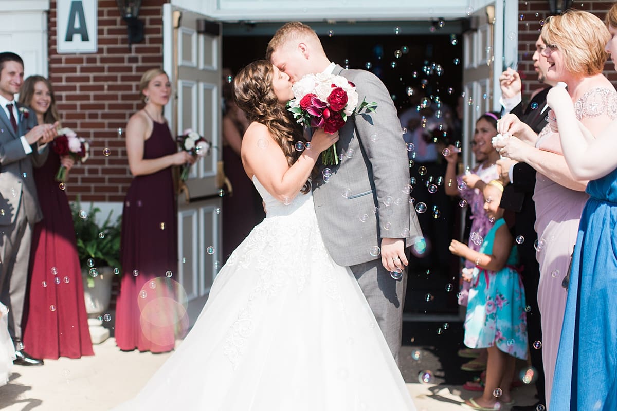 Arielle Peters Photography | Bride and groom outside brick church on wedding day at Trinity Church in South Bend, Indiana.