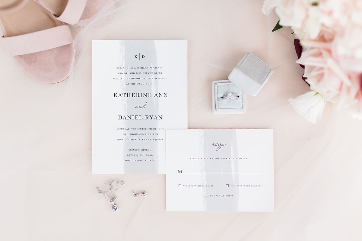 Arielle Peters Photography | Wedding invitations and rings on wedding day at Trinity Church in South Bend, Indiana.