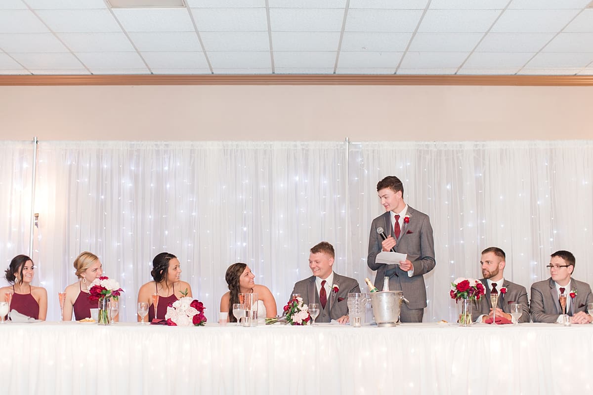 Arielle Peters Photography | Best man giving speech at wedding reception at Sts. Peter and Paul Social Hall in South Bend, Indiana on wedding day.