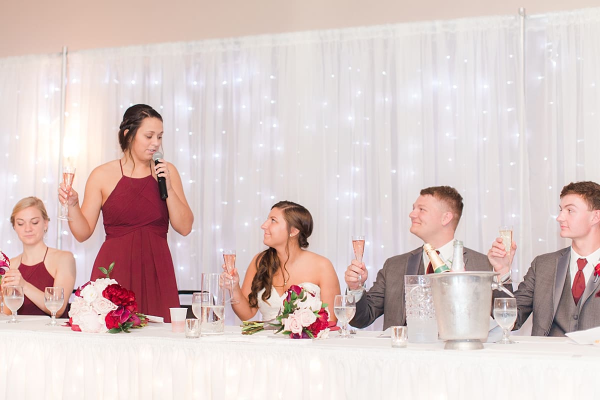 Arielle Peters Photography | Maid of honor giving speech at wedding reception at Sts. Peter and Paul Social Hall in South Bend, Indiana on wedding day.