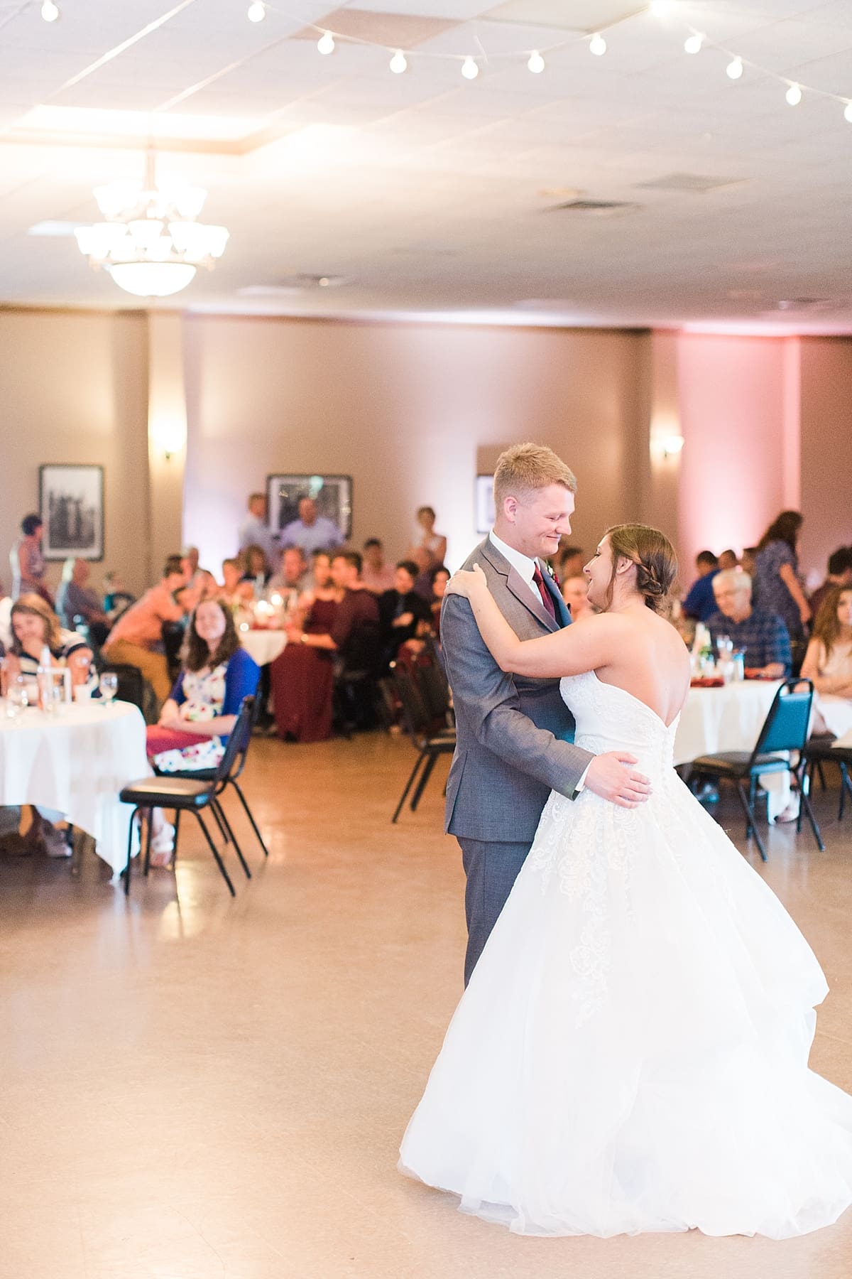 Arielle Peters Photography | Bride and groom sharing first dance at wedding reception at Sts. Peter and Paul Social Hall in South Bend, Indiana.