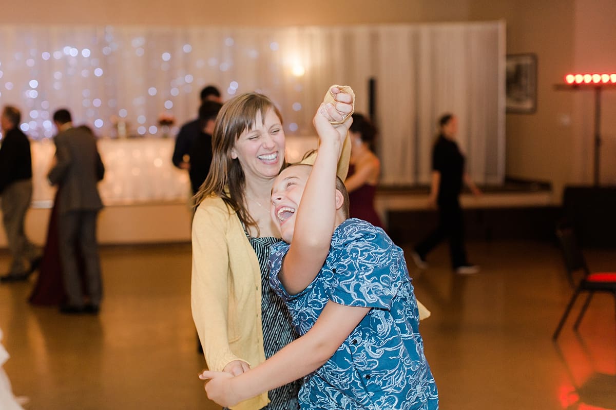 Arielle Peters Photography | Wedding guests dancing at wedding reception at Sts. Peter and Paul Social Hall in South Bend, Indiana.
