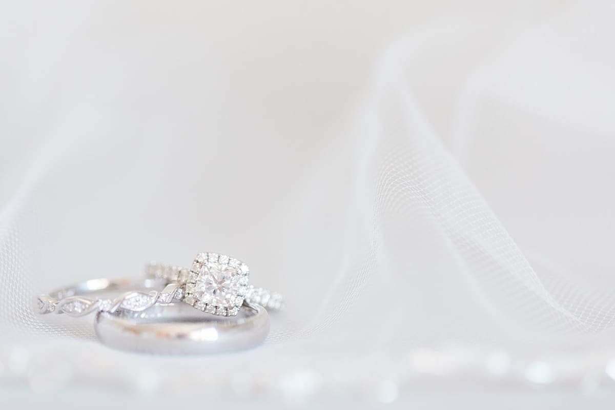 Arielle Peters Photography | Wedding rings lying on veil on wedding day at St. Joe Farm in Granger, Indiana.