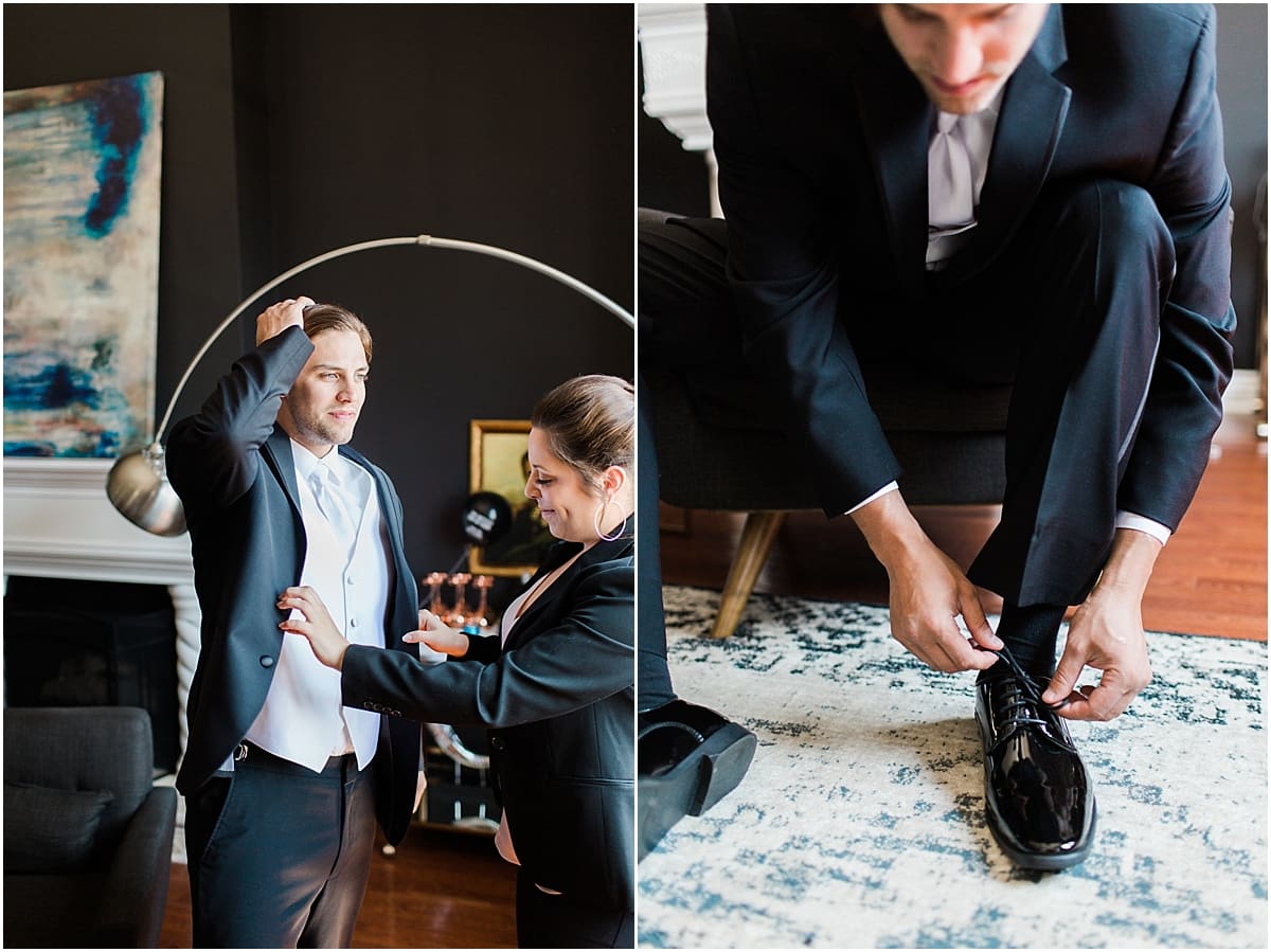 Arielle Peters Photography | Groom putting on tux while getting ready on wedding day at Loft 310 in Kalamazoo, Michigan.