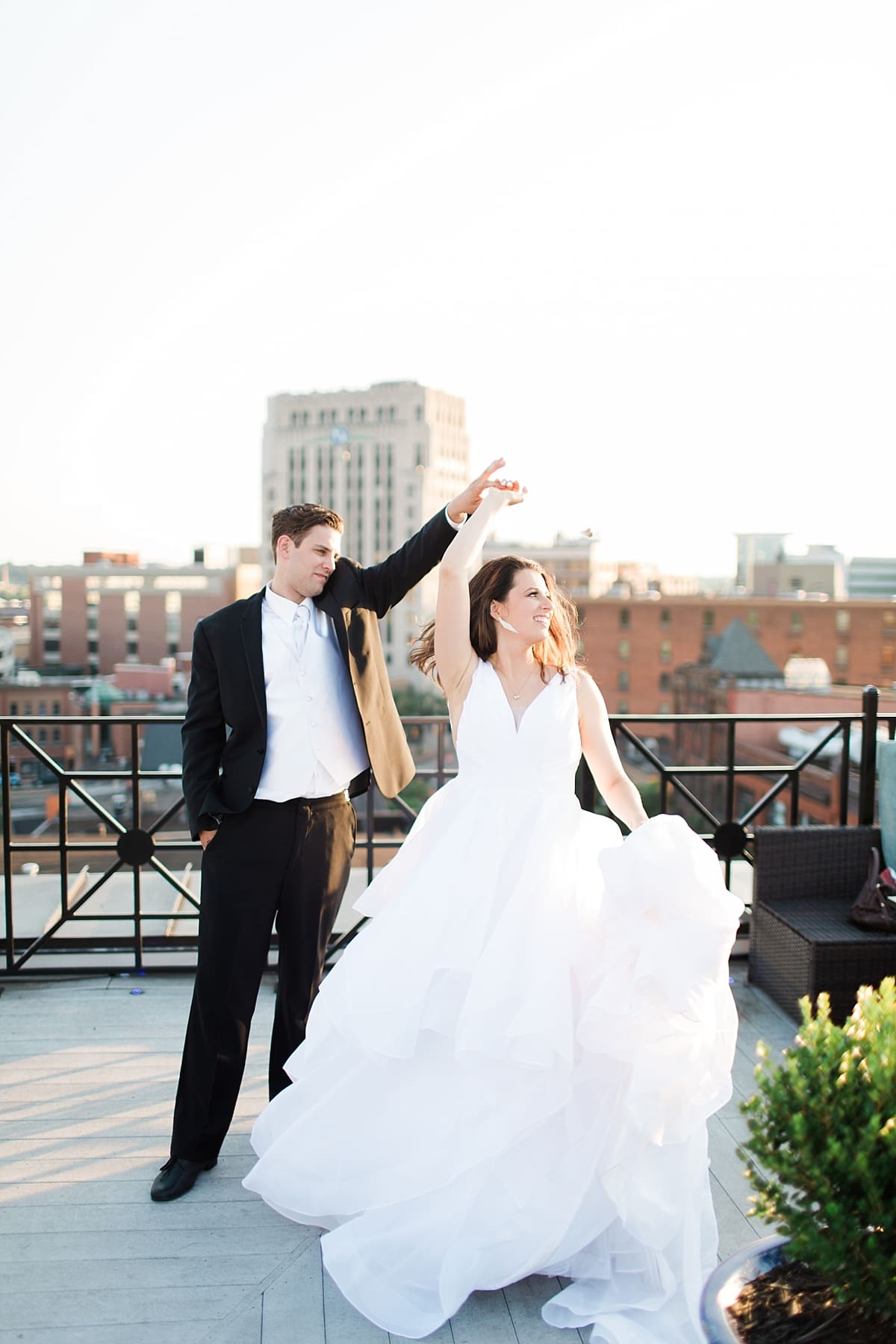 Arielle Peters Photography | Bride and groom dancing on rooftop terrace on wedding day at Loft 310 in Kalamazoo, Michigan.