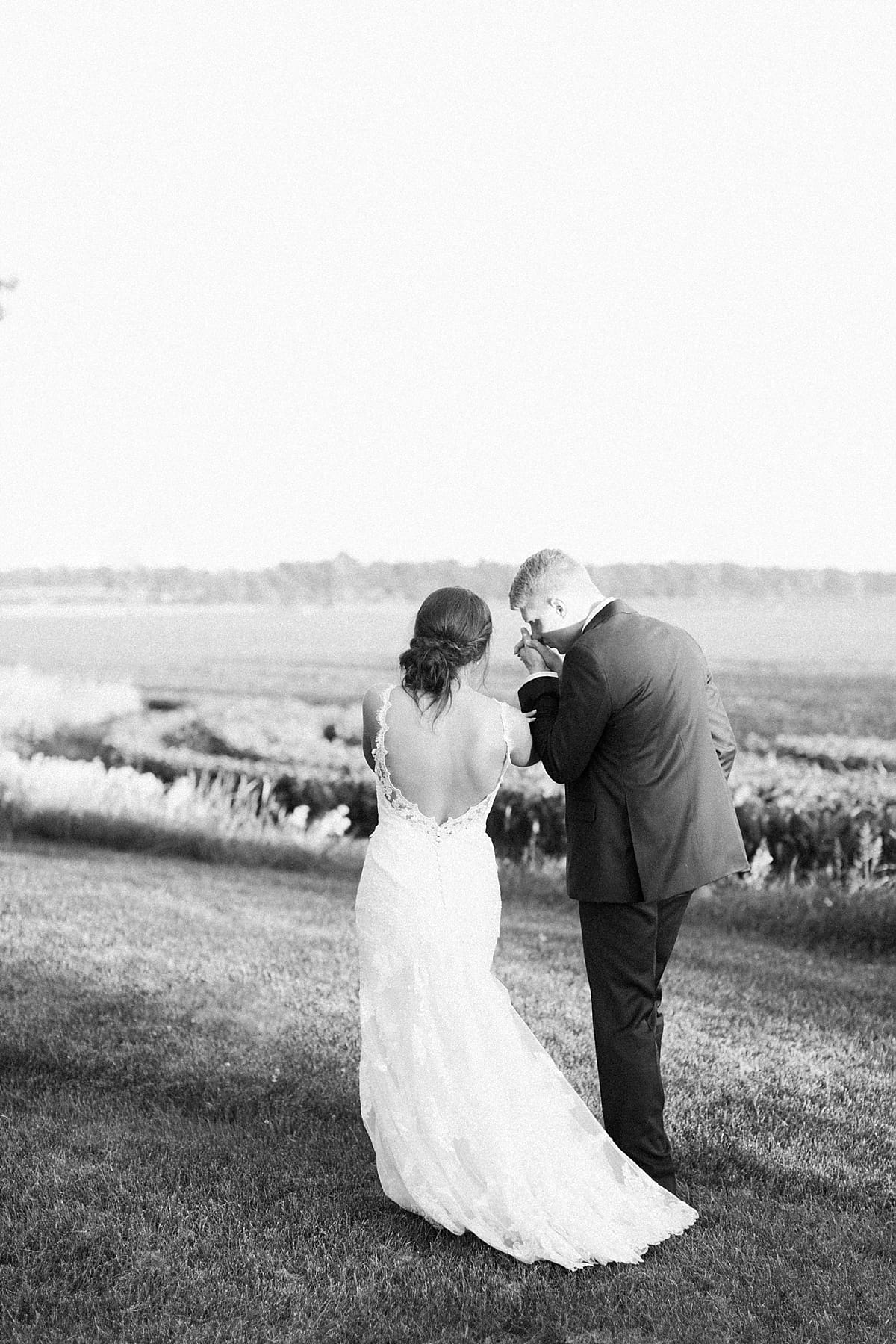 Arielle Peters Photography | Bride and groom in open field on historic farm on wedding day at St. Joe Farm in Granger, Indiana.
