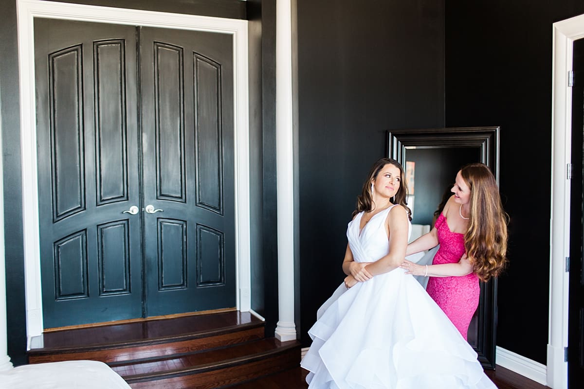 Arielle Peters Photography | Mother of the bride helping bride get ready on wedding day at Loft 310 in Kalamazoo, Michigan.