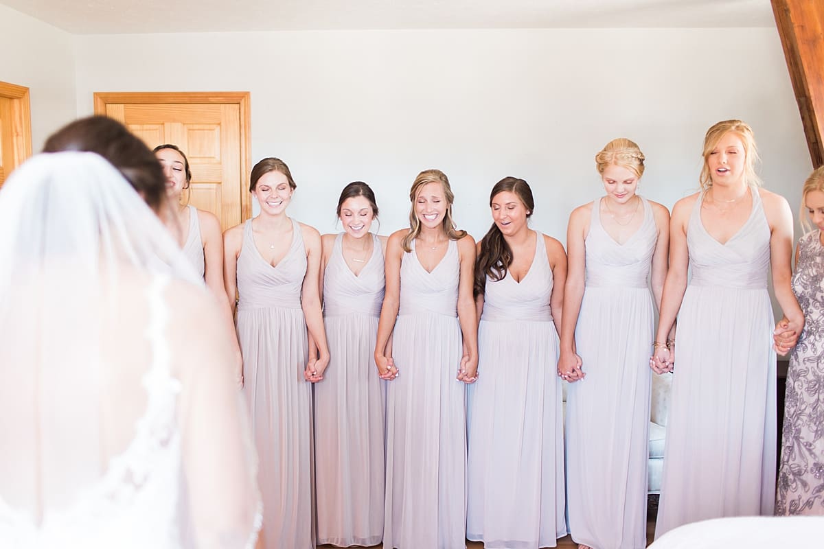 Arielle Peters Photography | Bride and bridesmaids having first reveal on wedding day at St. Joe Farm in Granger, Indiana.