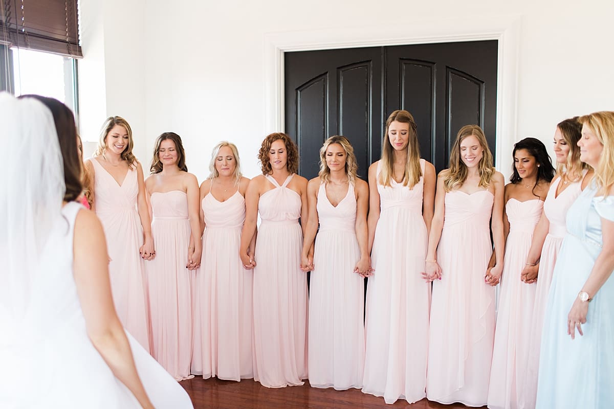 Arielle Peters Photography | Bride and bridesmaids having first reveal on wedding day at Loft 310 in Kalamazoo, Michigan.
