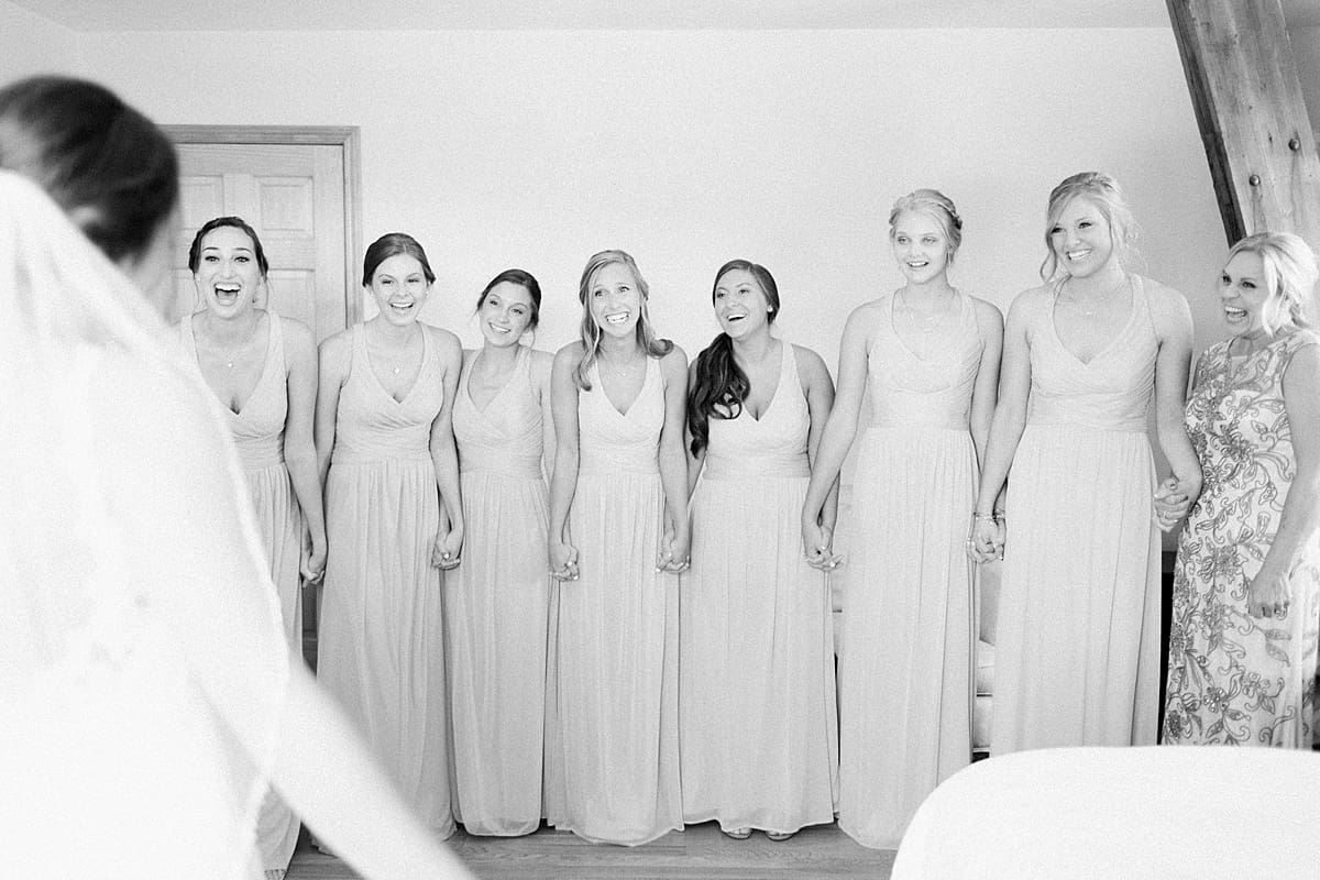 Arielle Peters Photography | Bride and bridesmaids having first reveal on wedding day at St. Joe Farm in Granger, Indiana.