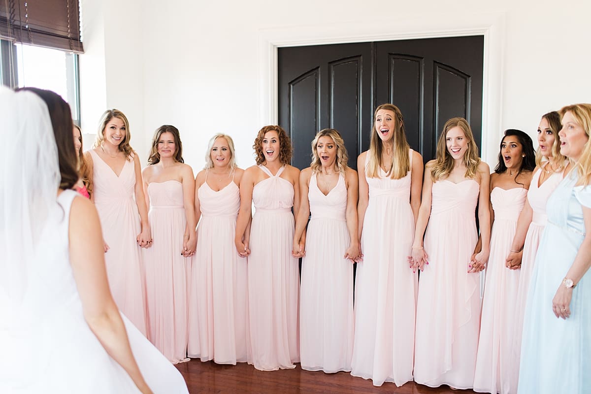 Arielle Peters Photography | Bride and bridesmaids having first reveal on wedding day at Loft 310 in Kalamazoo, Michigan.