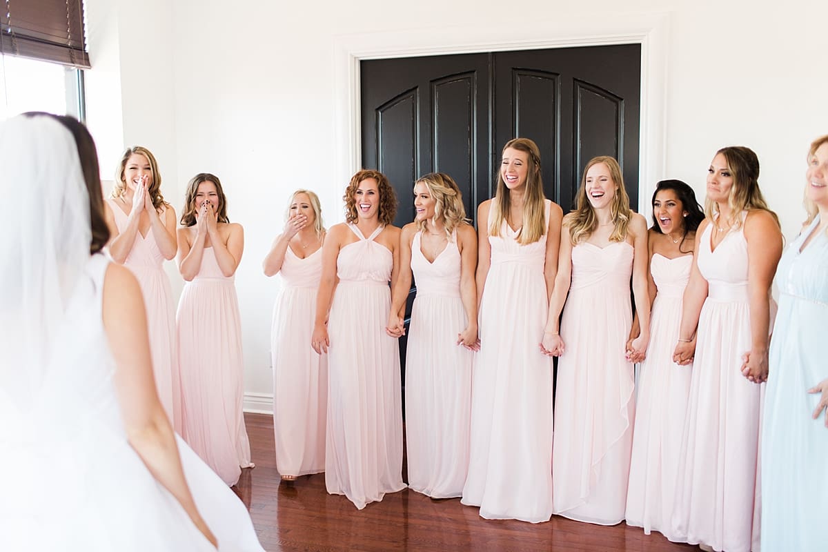 Arielle Peters Photography | Bride and bridesmaids having first reveal on wedding day at Loft 310 in Kalamazoo, Michigan.