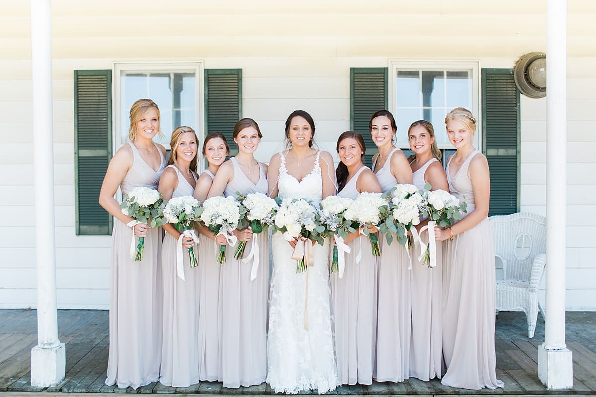 Arielle Peters Photography | Bride and bridesmaids on front porch on wedding day at St. Joe Farm in Granger, Indiana.