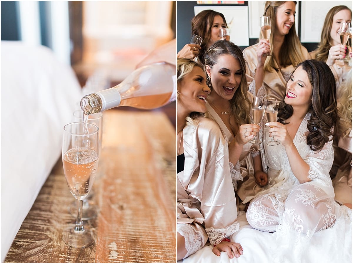 Arielle Peters Photography | Bride and bridesmaids raising a glass in robes on wedding day at Loft 310 in Kalamazoo, Michigan.