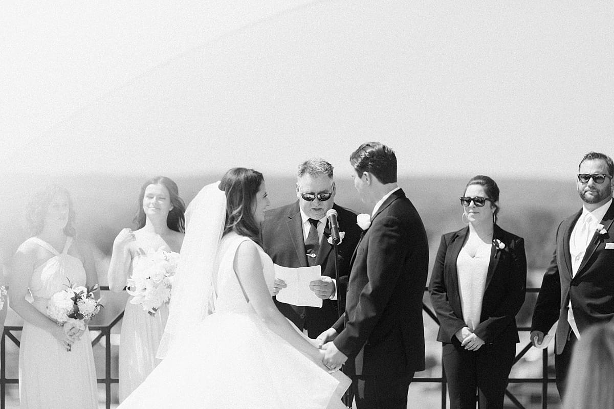 Arielle Peters Photography | Bride and groom at alter on rooftop on wedding day at Loft 310 in Kalamazoo, Michigan.