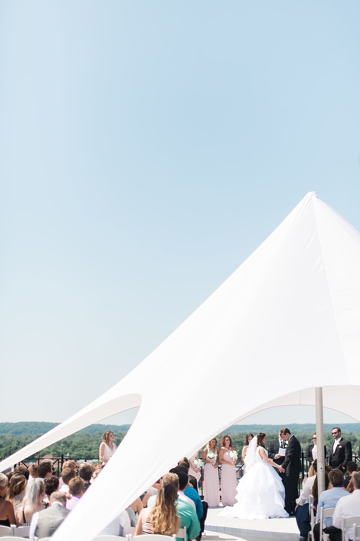 Arielle Peters Photography | Bride and groom at alter on rooftop on wedding day at Loft 310 in Kalamazoo, Michigan.