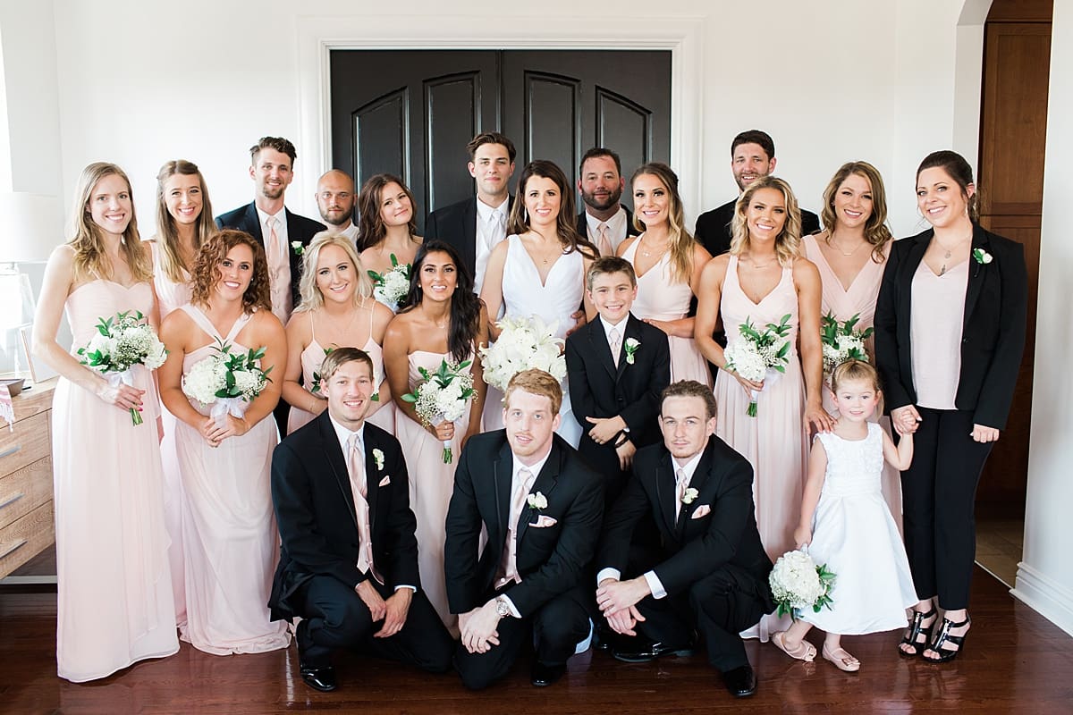 Arielle Peters Photography | Wedding party in front of french doors on wedding day at Loft 310 in Kalamazoo, Michigan.
