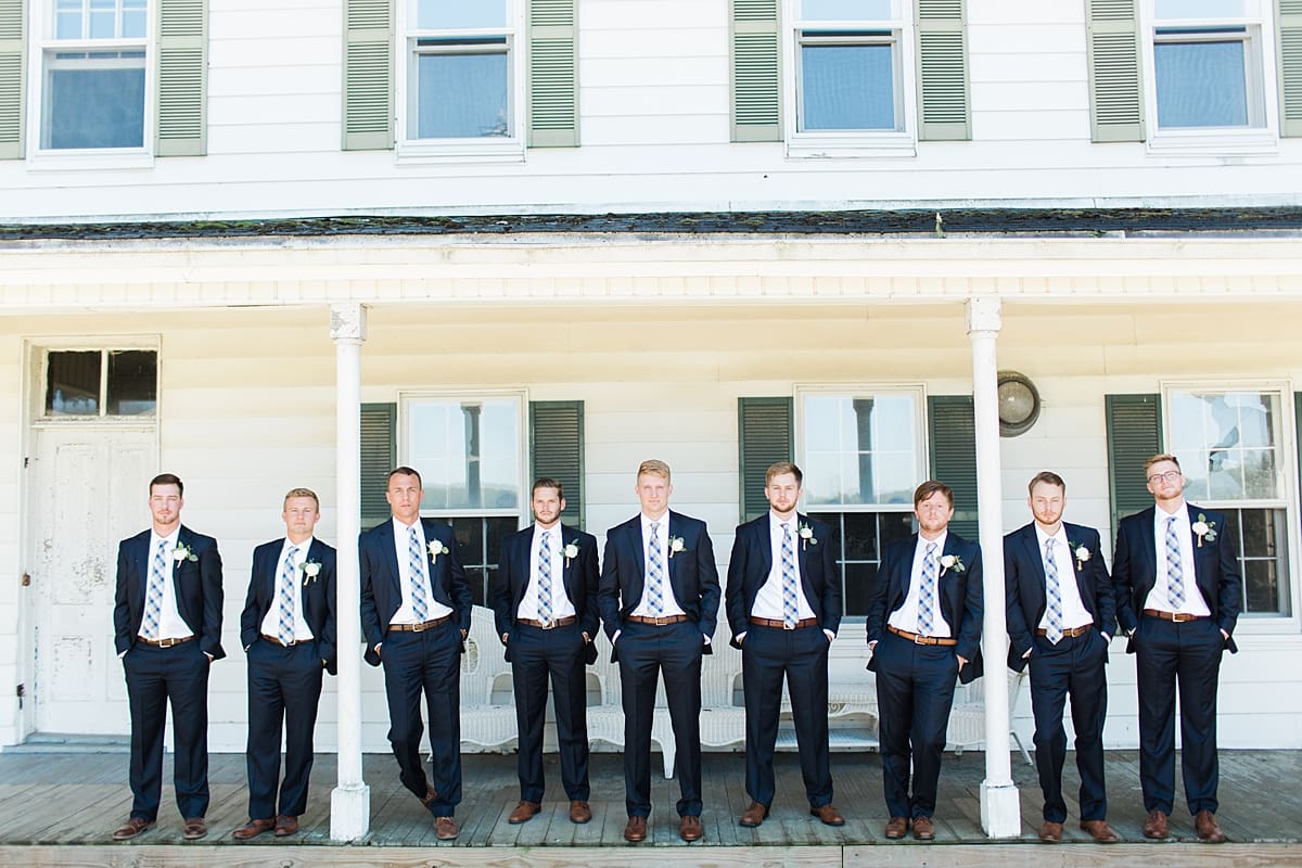 Arielle Peters Photography | Groom and groomsmen on historic front porch on wedding day at St. Joe Farm in Granger, Indiana.
